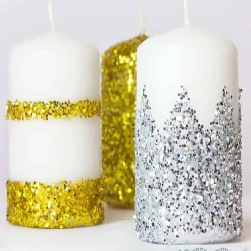 تزیین شمعها با اکلیل عید نوروز